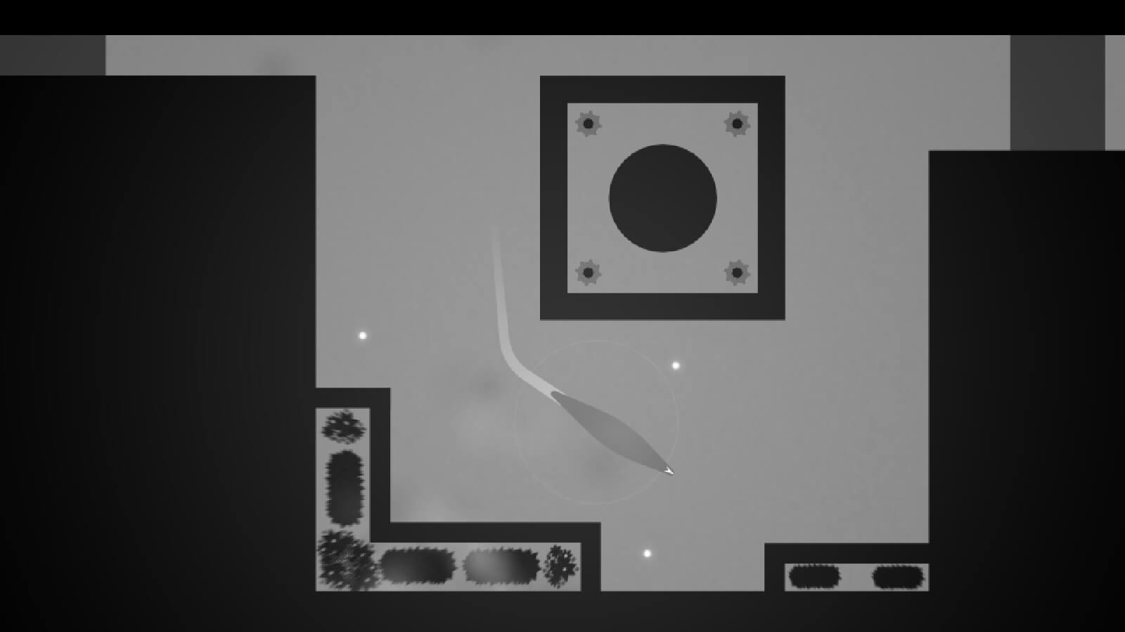 Seen from top down, a slug-like creature moves in an angular enclosed space all rendered in grayscale.