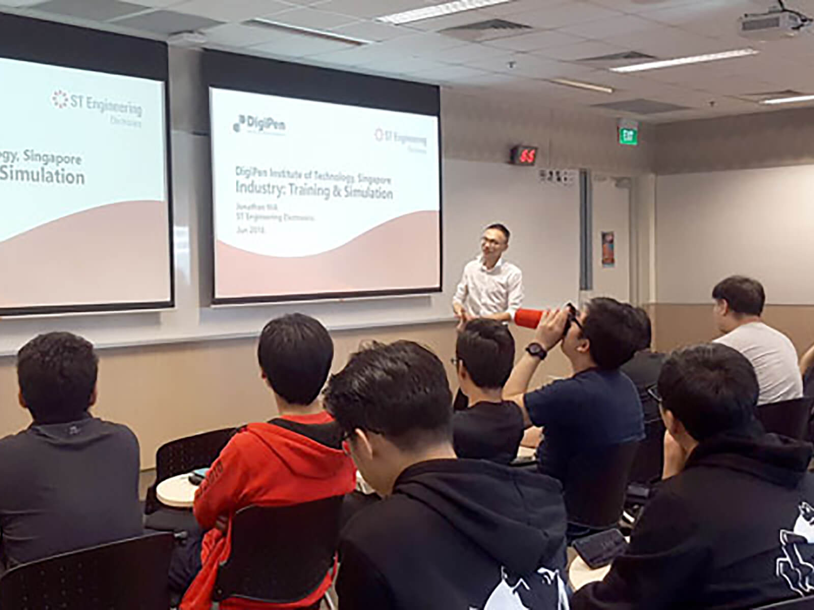 ST Engineering Assistant Division Manager Jonathan Hia speaks in front of a class of DigiPen (Singapore) students