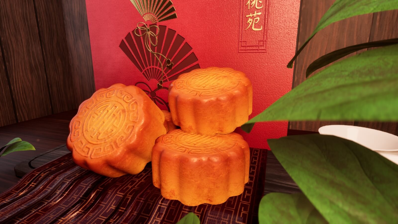 A close up of mooncakes in front of a red box.