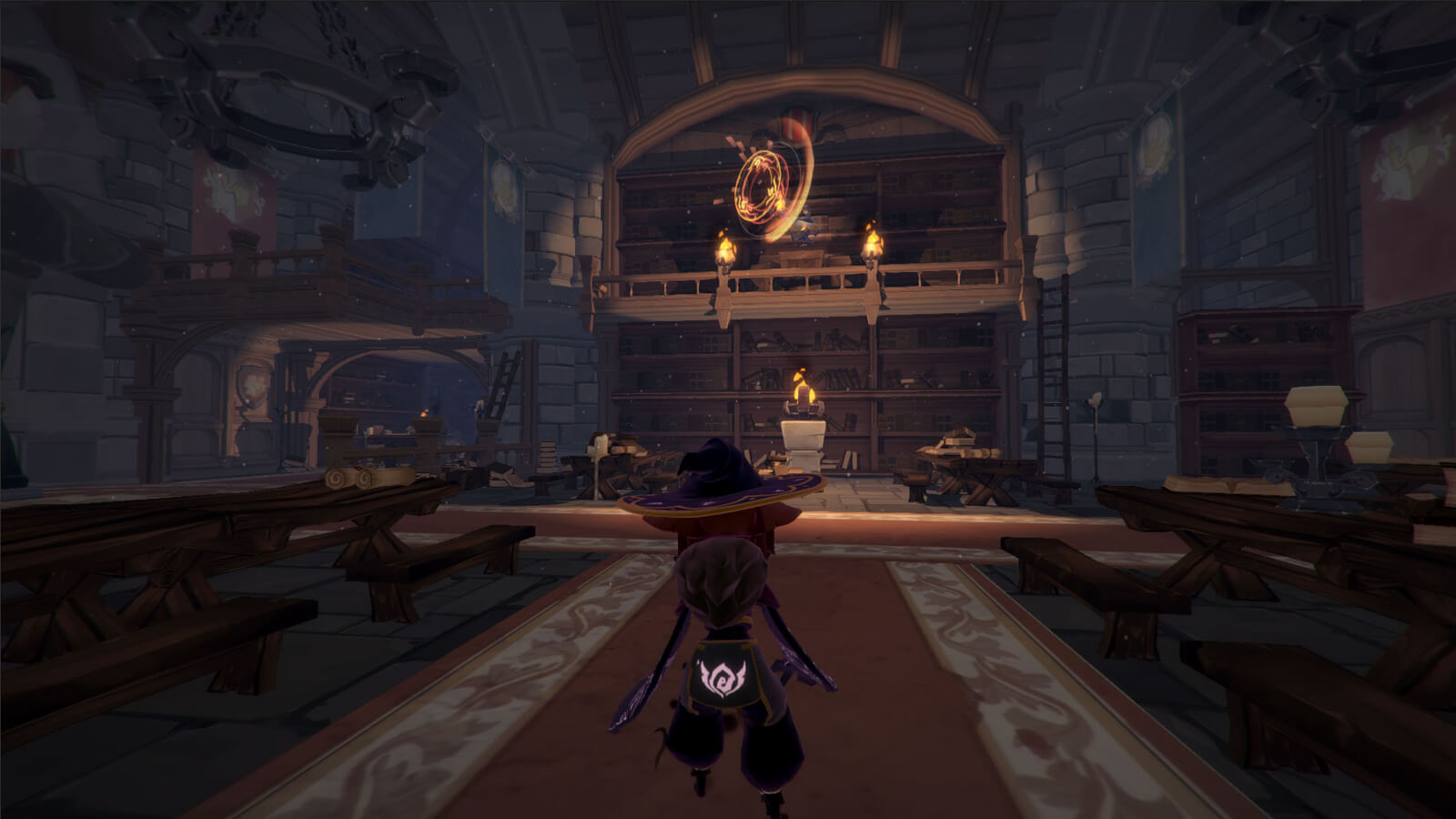 View of the player's character from behind standing in a torch-lit library with several tables and benches nearby
